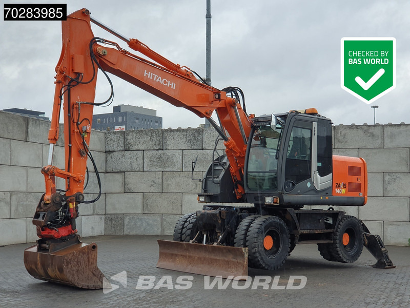 Hitachi ZX140W -3 OUTRIGGERS - ROTOTILT - Riteņu ekskavators: foto 1 Hitachi ZX140W -3 OUTRIGGERS - ROTOTILT - Riteņu ekskavators: foto 1