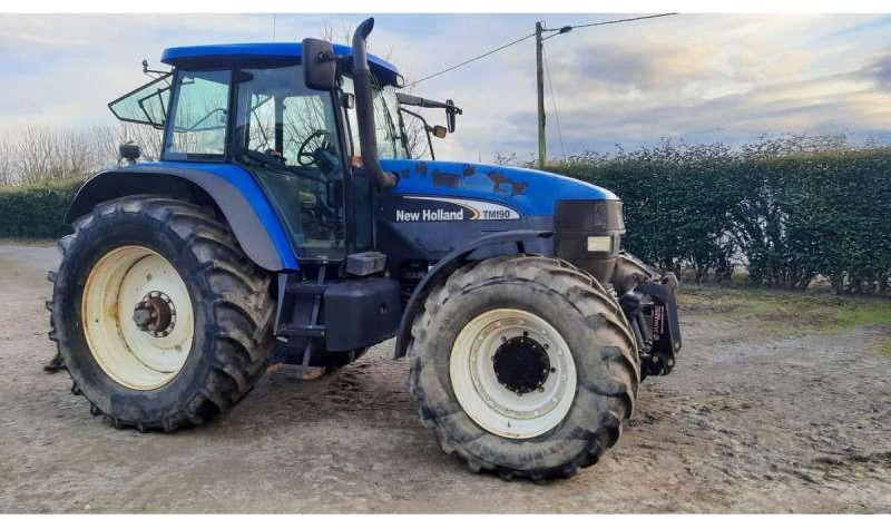 New Holland TM190 - Traktors: foto 1 New Holland TM190 - Traktors: foto 1