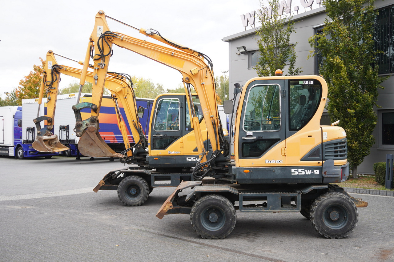 Hyundai Robex 55W-9 Wheeled Excavator 5.5t / 2pcs - Ekskavators: foto 1 Hyundai Robex 55W-9 Wheeled Excavator 5.5t / 2pcs - Ekskavators: foto 1