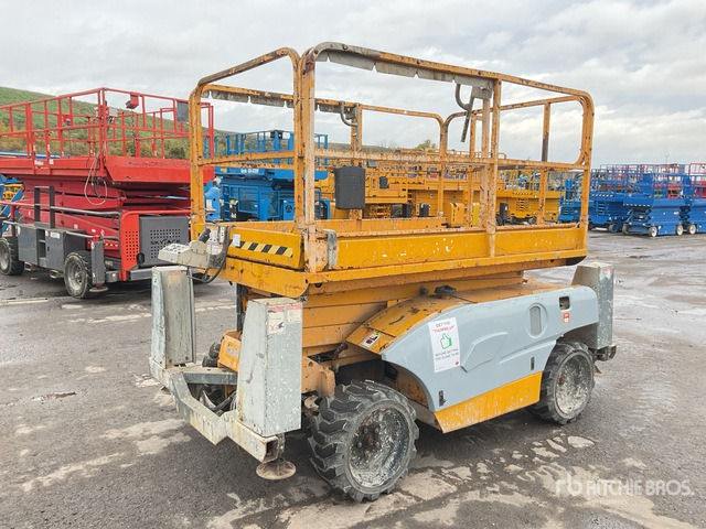 2014 Haulotte Compact 10DX 4x4 Diesel Scissor Lift - Šķērveida pacēlājs: foto 1 2014 Haulotte Compact 10DX 4x4 Diesel Scissor Lift - Šķērveida pacēlājs: foto 1