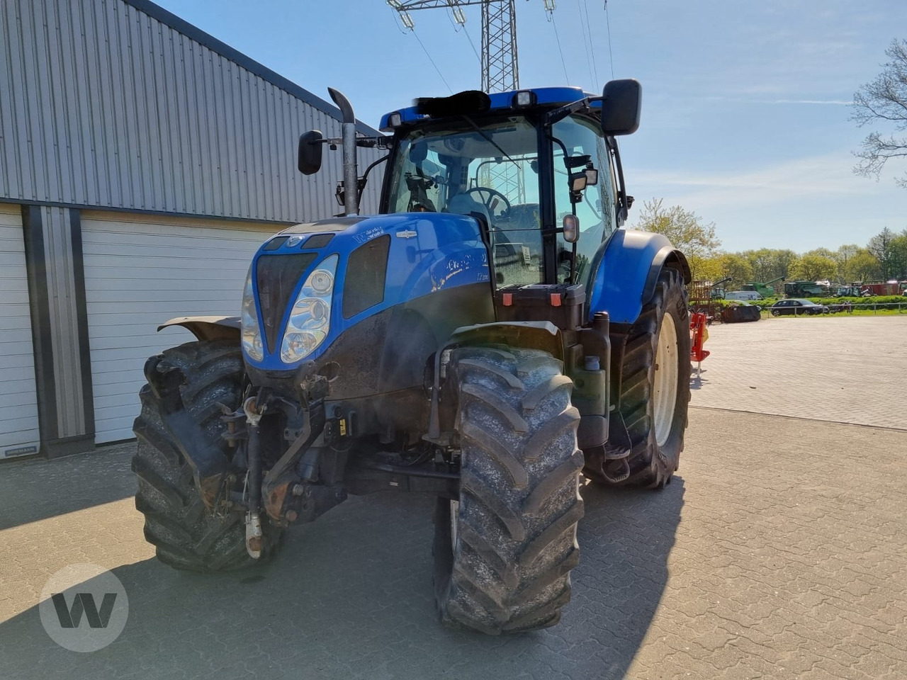 New Holland T 7.200 - Traktors: foto 1 New Holland T 7.200 - Traktors: foto 1