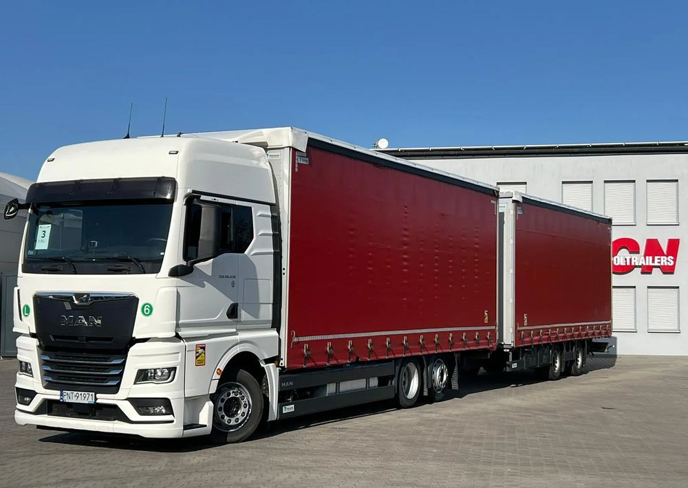 MAN TGX 26.470 z przyczepą Redos - Kravas automašīna ar tentu: foto 1 MAN TGX 26.470 z przyczepą Redos - Kravas automašīna ar tentu: foto 1
