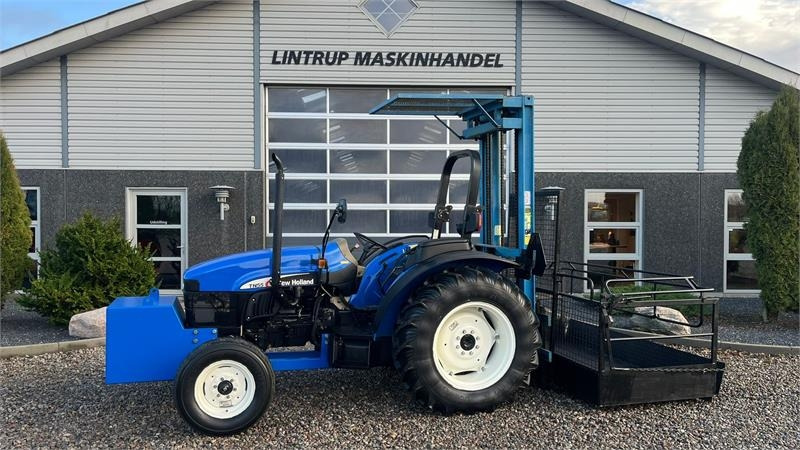 New Holland TN55D Med Byggelift - Traktors: foto 1 New Holland TN55D Med Byggelift - Traktors: foto 1