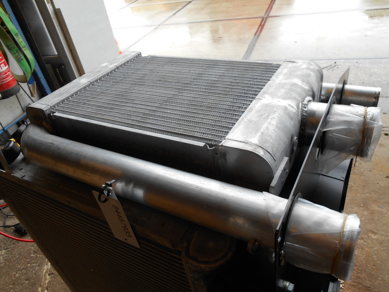 New Holland 84487933 - Dzesēšanas sistēma - Celtniecības tehnika: foto 2 New Holland 84487933 - Dzesēšanas sistēma - Celtniecības tehnika: foto 2