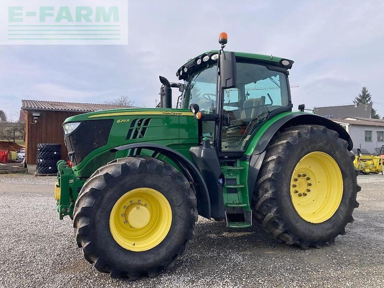John Deere 6215r - Traktors: foto 1 John Deere 6215r - Traktors: foto 1