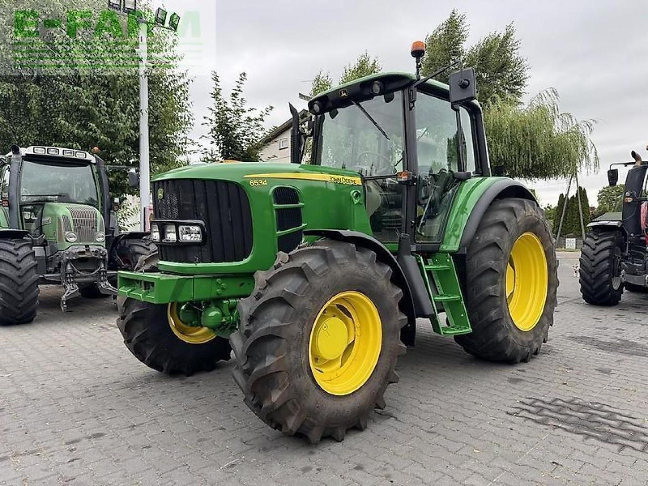 John Deere 6534 - Traktors: foto 1 John Deere 6534 - Traktors: foto 1