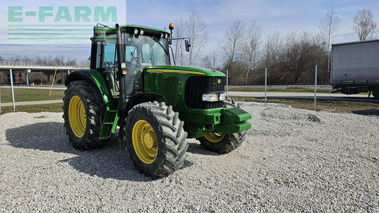 John Deere 6920 premium - Traktors: foto 1 John Deere 6920 premium - Traktors: foto 1