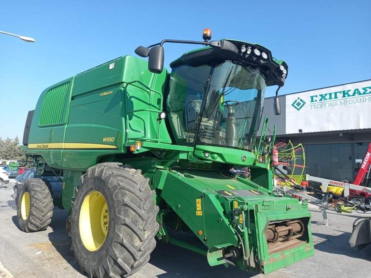 John Deere W650 - Labības kombains: foto 1 John Deere W650 - Labības kombains: foto 1