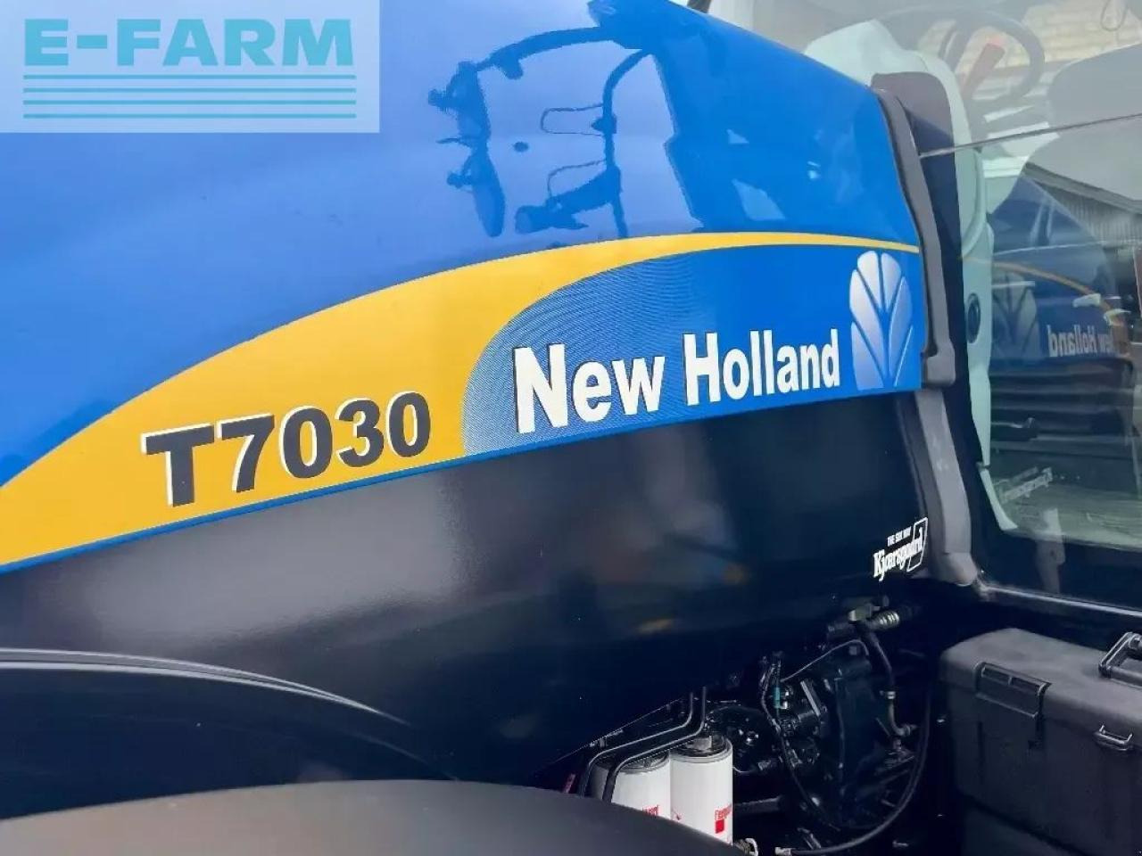 New Holland t 7030 - Traktors: foto 2 New Holland t 7030 - Traktors: foto 2