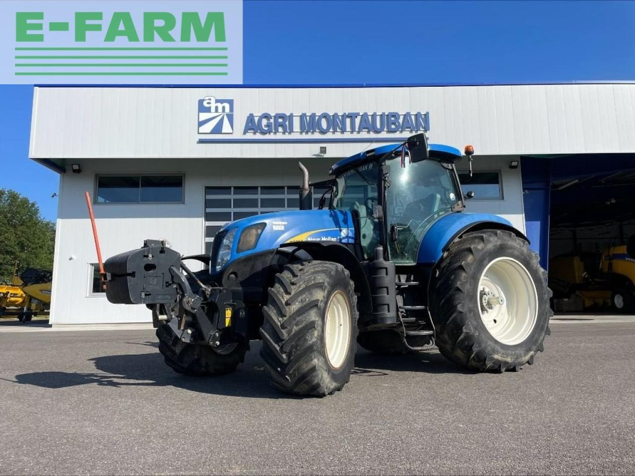 New Holland t 7050 - Traktors: foto 1 New Holland t 7050 - Traktors: foto 1