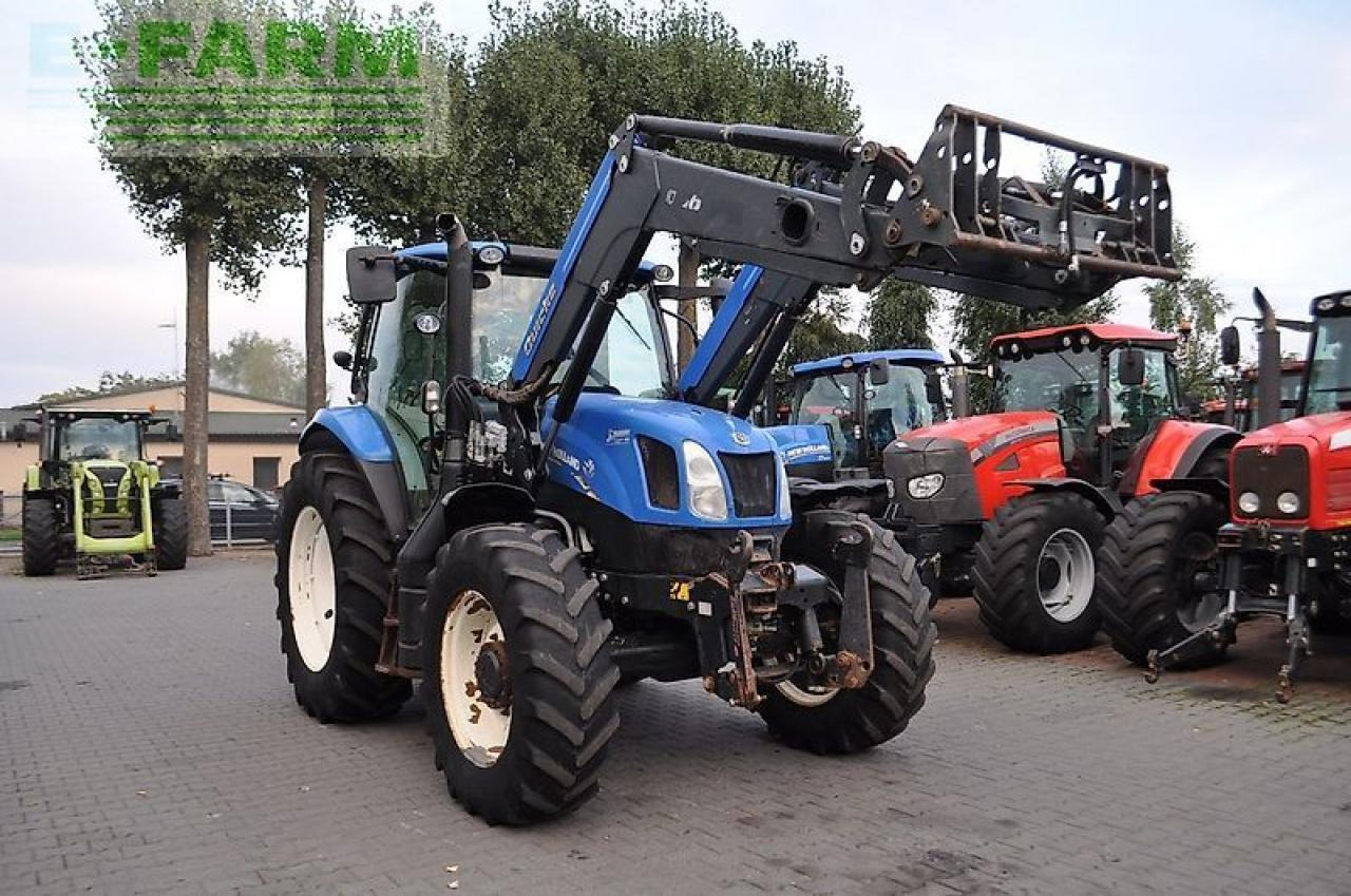 New Holland t6.140 + quicke q56 - Traktors: foto 3 New Holland t6.140 + quicke q56 - Traktors: foto 3