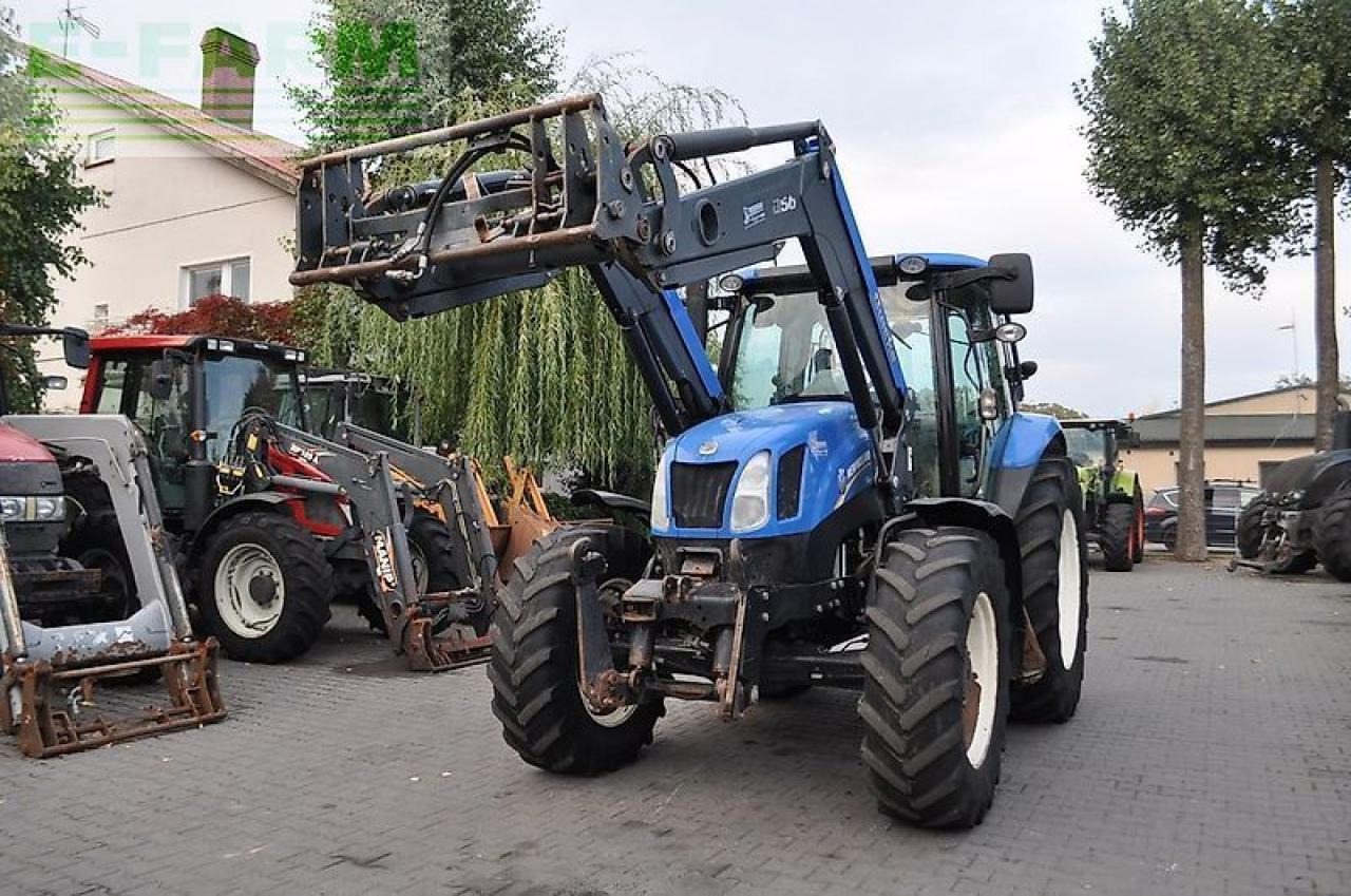 New Holland t6.140 + quicke q56 - Traktors: foto 2 New Holland t6.140 + quicke q56 - Traktors: foto 2