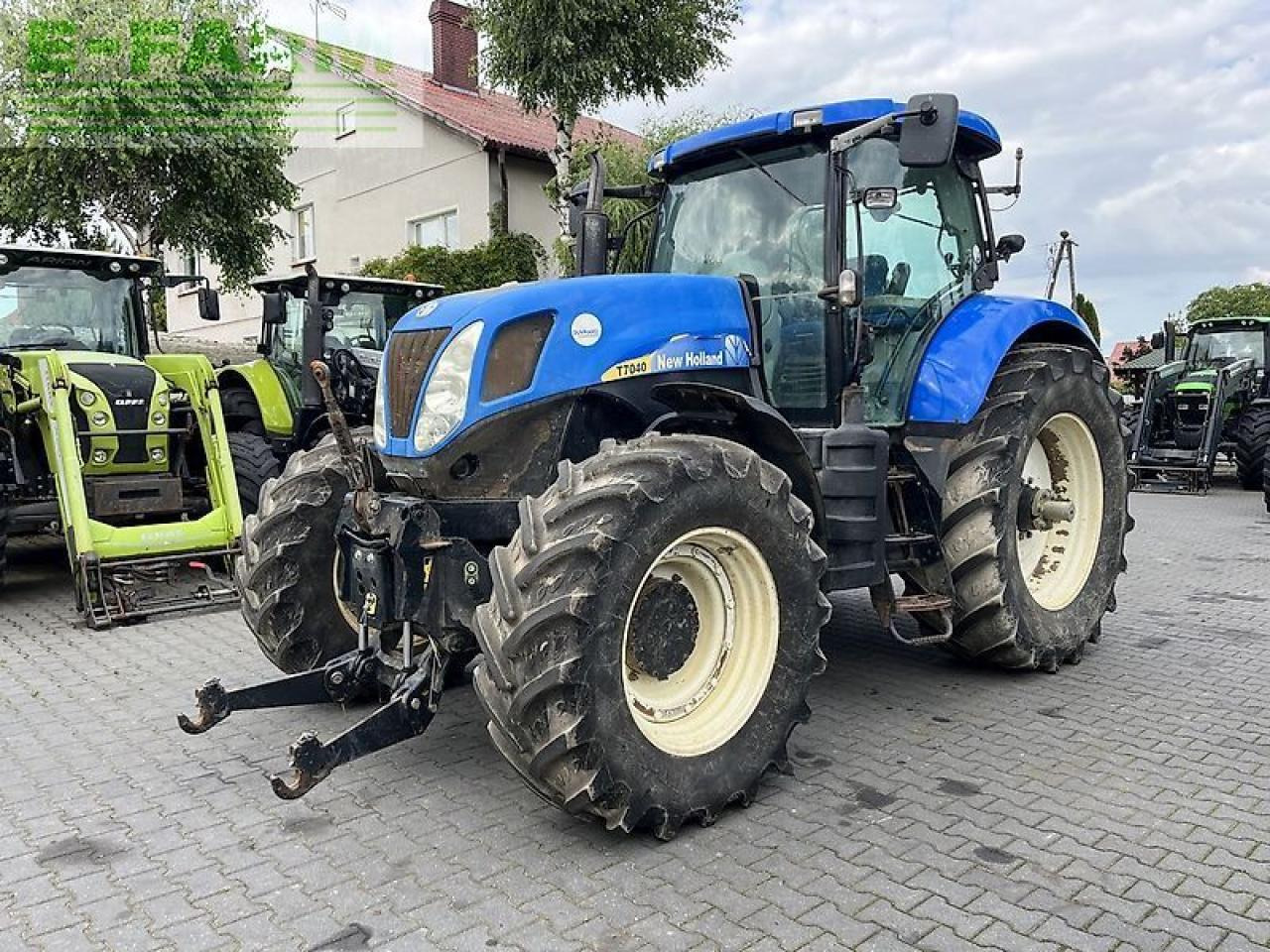 New Holland t7040 power command - Traktors: foto 1 New Holland t7040 power command - Traktors: foto 1