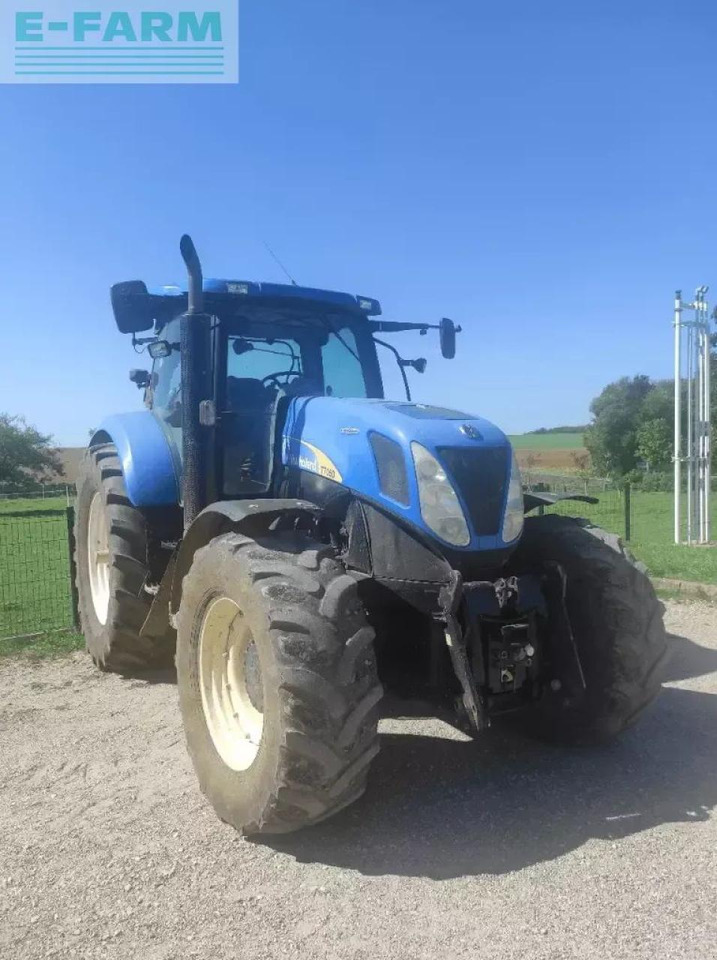 New Holland t7050 ac AC - Traktors: foto 1 New Holland t7050 ac AC - Traktors: foto 1