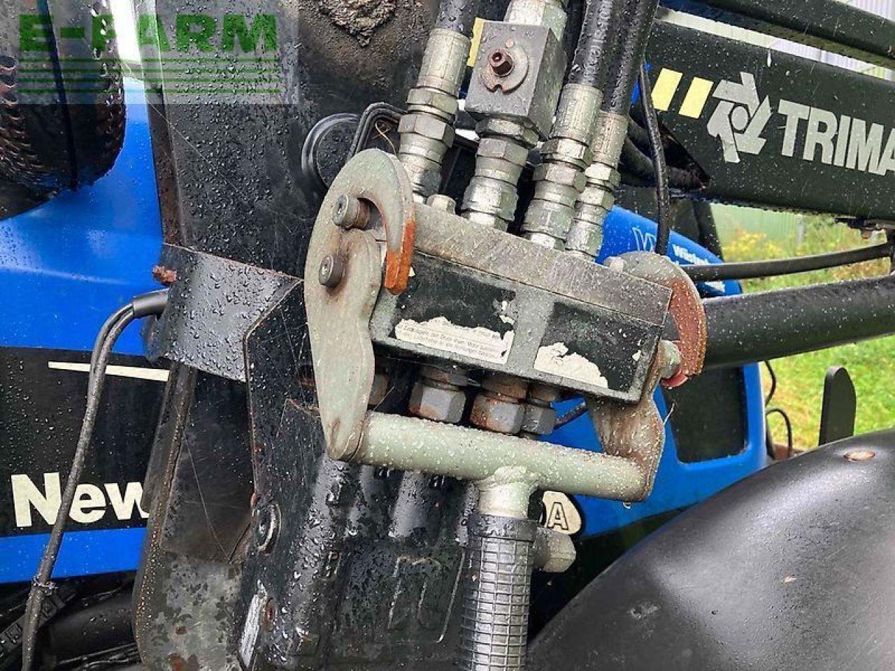 New Holland tl 100 a A - Traktors: foto 5 New Holland tl 100 a A - Traktors: foto 5