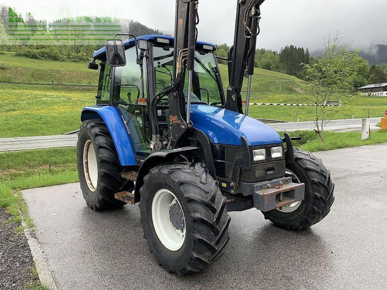 New Holland tl 70 a + hauer frontlader A - Traktors: foto 5 New Holland tl 70 a + hauer frontlader A - Traktors: foto 5