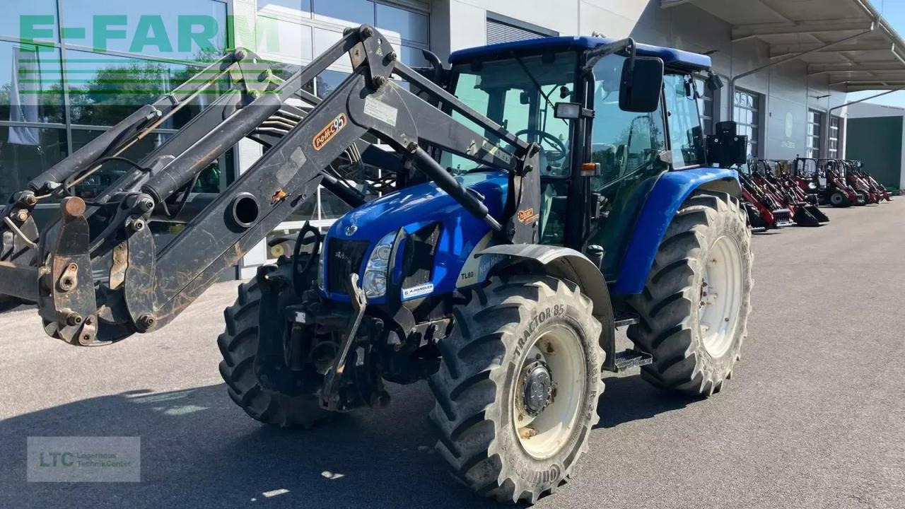 New Holland tl 80 a A - Traktors: foto 1 New Holland tl 80 a A - Traktors: foto 1