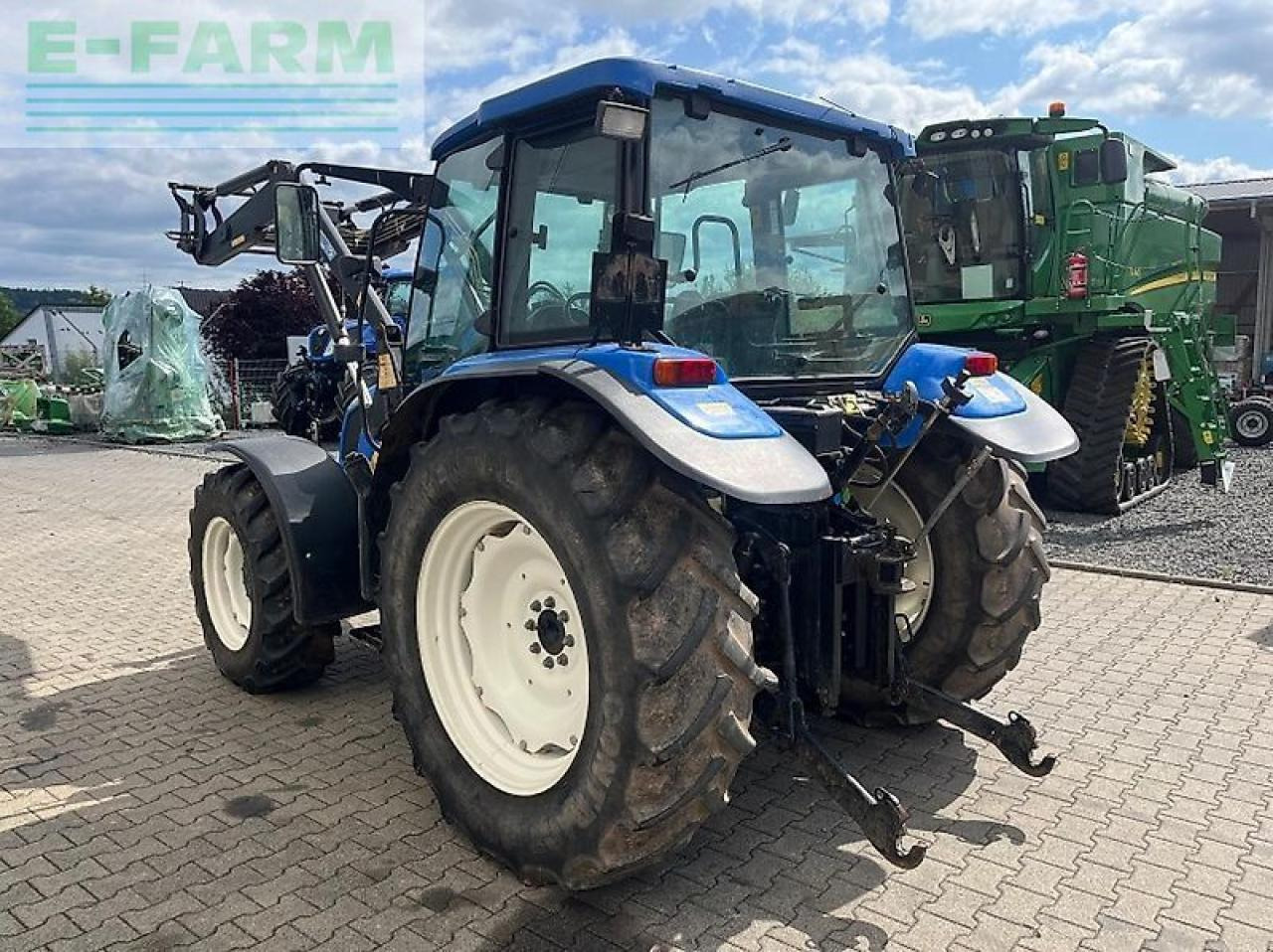 New Holland tl 90 a A - Traktors: foto 4 New Holland tl 90 a A - Traktors: foto 4