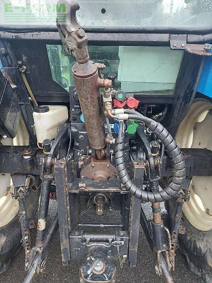 New Holland tl 90 a A - Traktors: foto 4 New Holland tl 90 a A - Traktors: foto 4