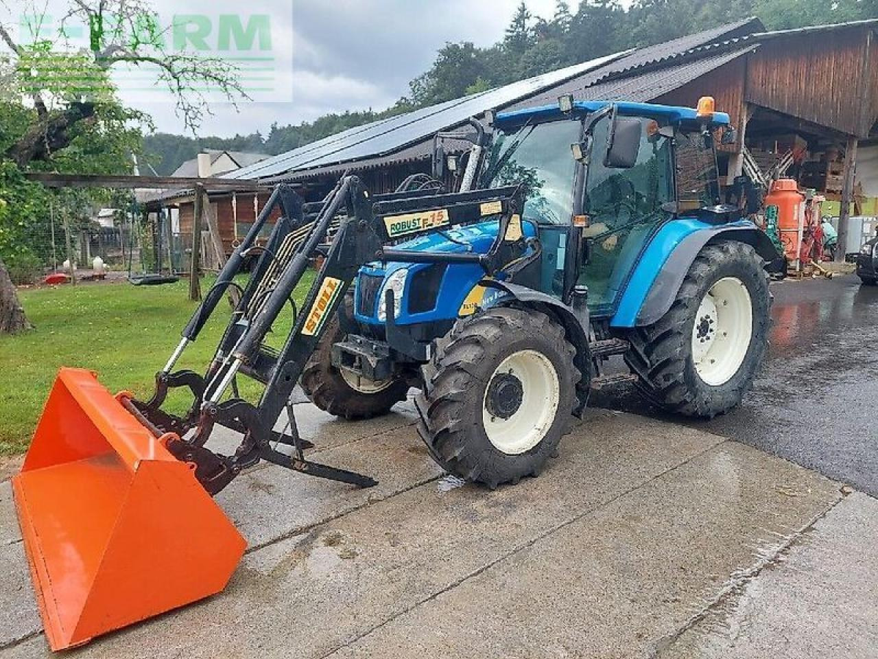 New Holland tl 90 a A - Traktors: foto 1 New Holland tl 90 a A - Traktors: foto 1