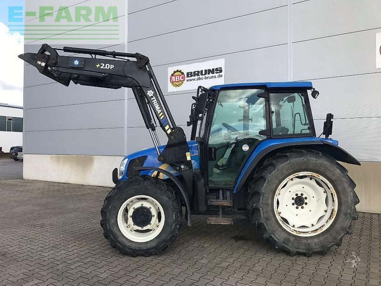New Holland tl 90 a dt A - Traktors: foto 2 New Holland tl 90 a dt A - Traktors: foto 2