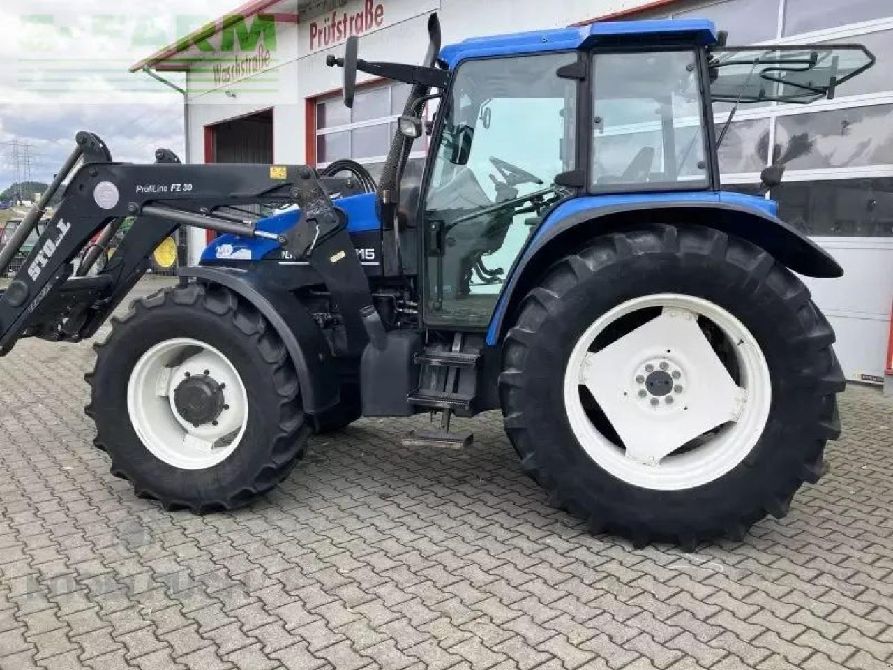 New Holland ts 115 - Traktors: foto 1 New Holland ts 115 - Traktors: foto 1