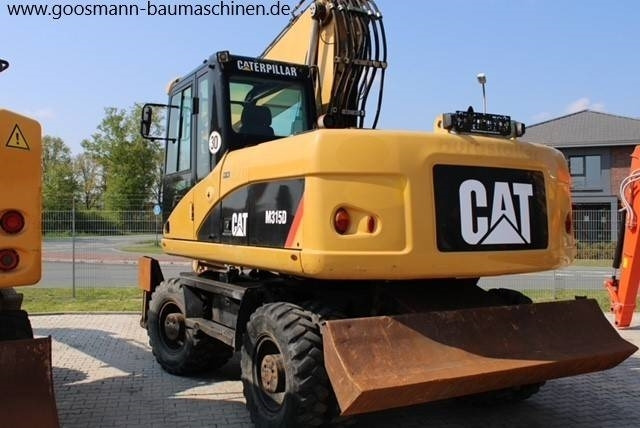 CAT M 315 D - Riteņu ekskavators: foto 2 CAT M 315 D - Riteņu ekskavators: foto 2