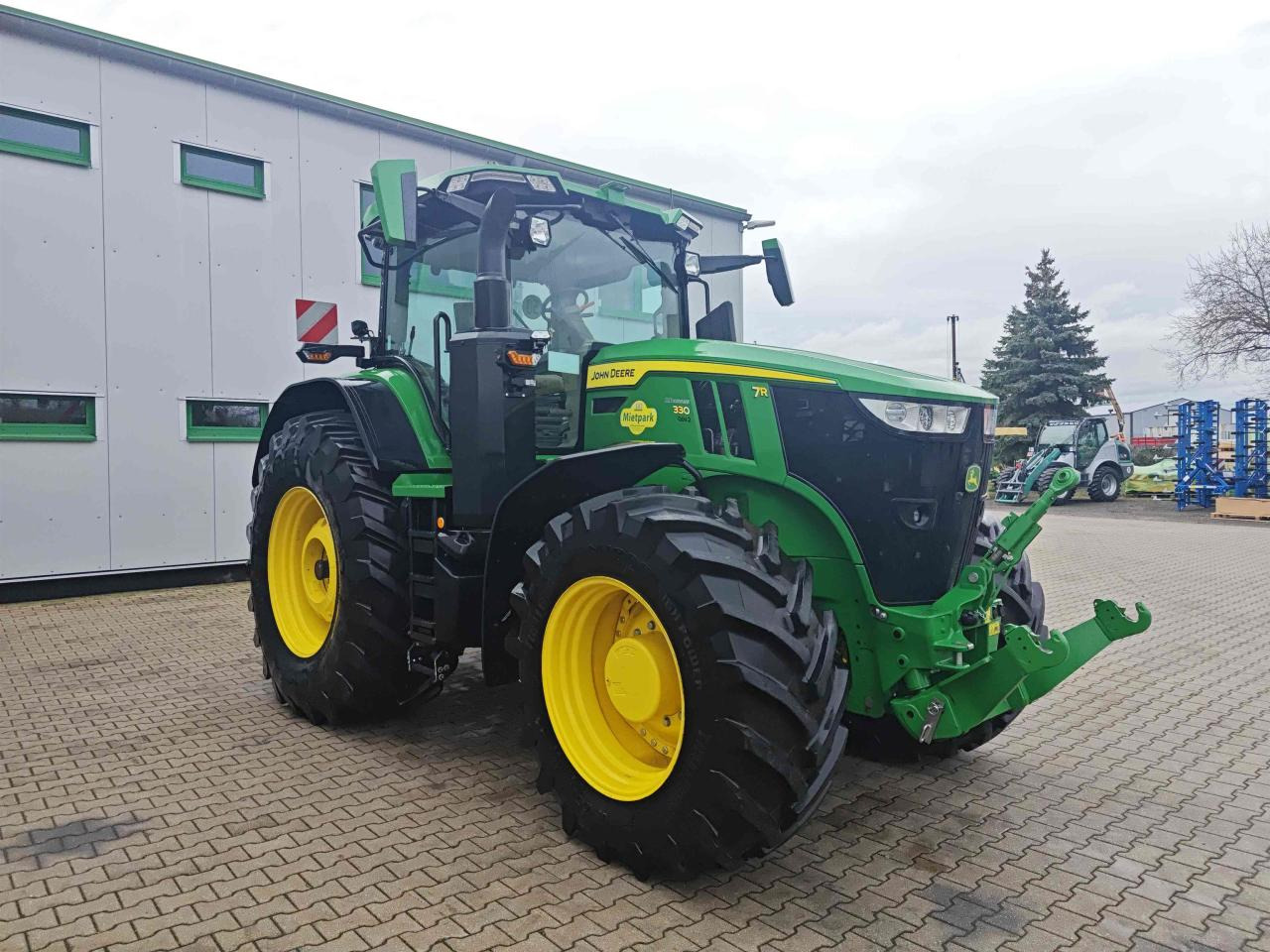 John Deere 7R 330 - Traktors: foto 1 John Deere 7R 330 - Traktors: foto 1