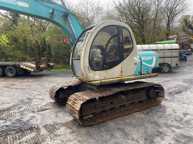 Kobelco SK100 - Kāpurķēžu ekskavators: foto 1 Kobelco SK100 - Kāpurķēžu ekskavators: foto 1