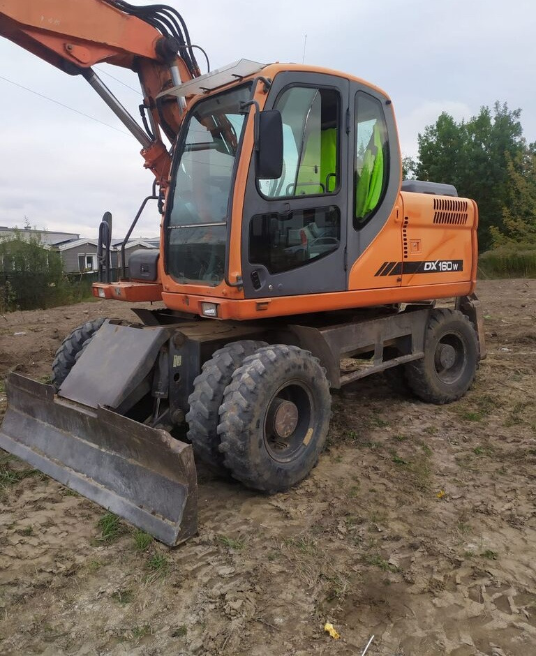 Doosan DX160 w - Riteņu ekskavators: foto 1 Doosan DX160 w - Riteņu ekskavators: foto 1