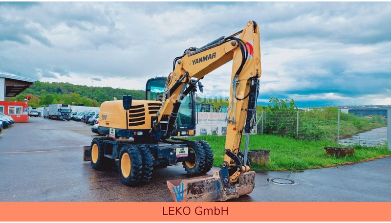 Yanmar B 95W Mit Drei Löffeln und Ein Hammer - Riteņu ekskavators: foto 1 Yanmar B 95W Mit Drei Löffeln und Ein Hammer - Riteņu ekskavators: foto 1