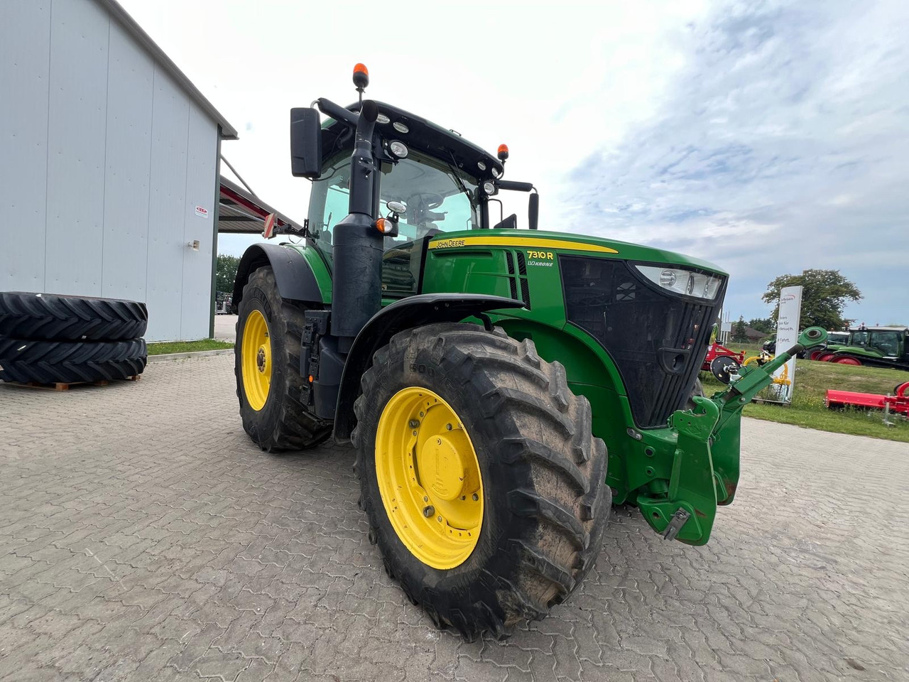 John Deere 7310 R - Traktors: foto 1 John Deere 7310 R - Traktors: foto 1