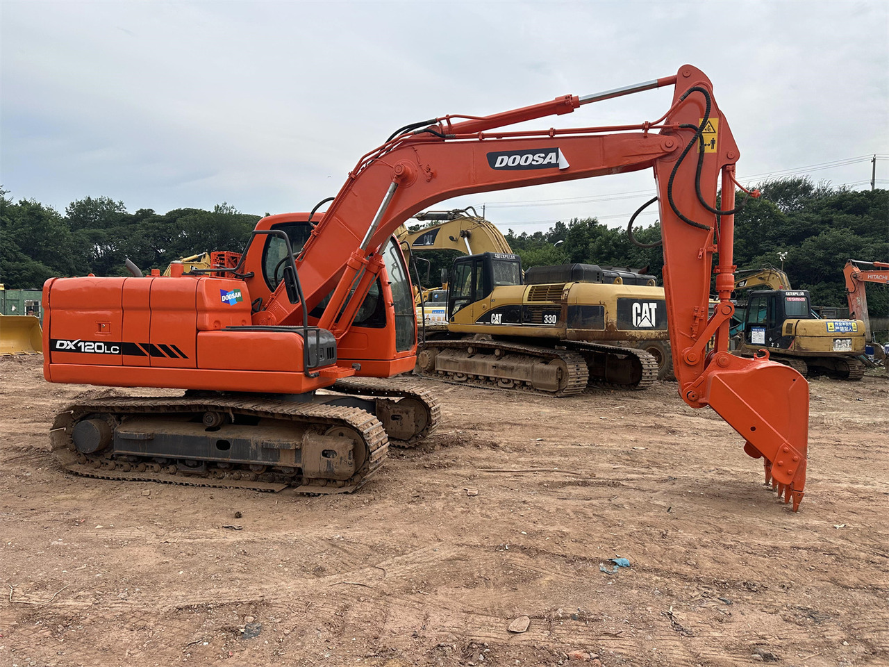 Doosan DX120 - Kāpurķēžu ekskavators: foto 1 Doosan DX120 - Kāpurķēžu ekskavators: foto 1