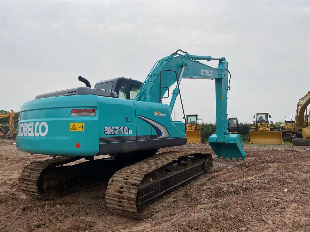 KOBELCO SK210LC-8 - Kāpurķēžu ekskavators: foto 1 KOBELCO SK210LC-8 - Kāpurķēžu ekskavators: foto 1