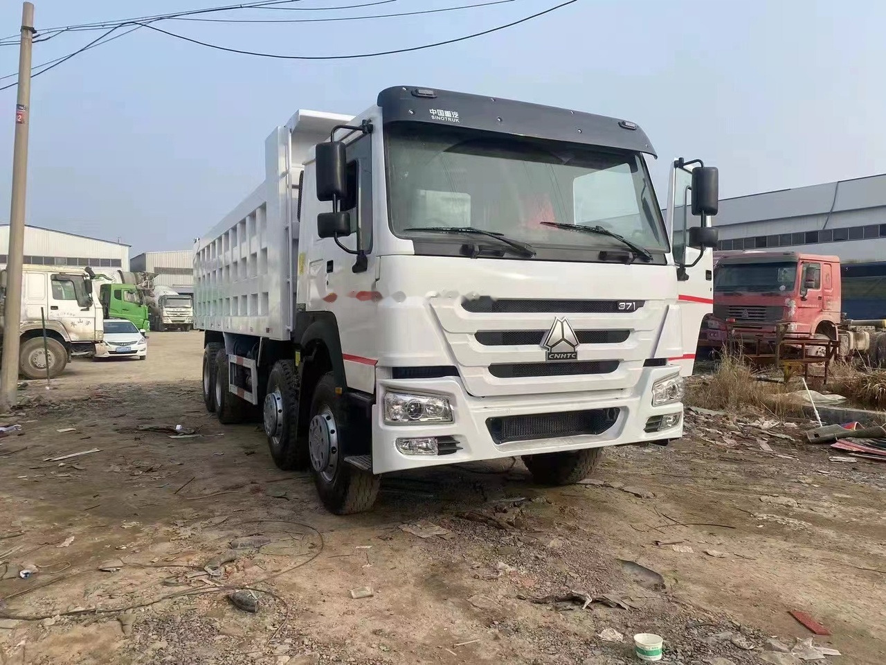 SINOTRUK HOWO 371 Tipper truck - Kravas automašīna pašizgāzējs: foto 4 SINOTRUK HOWO 371 Tipper truck - Kravas automašīna pašizgāzējs: foto 4