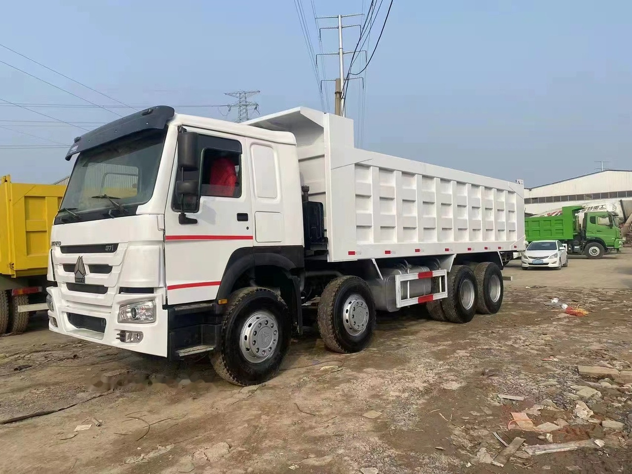 SINOTRUK HOWO 371 Tipper truck - Kravas automašīna pašizgāzējs: foto 1 SINOTRUK HOWO 371 Tipper truck - Kravas automašīna pašizgāzējs: foto 1