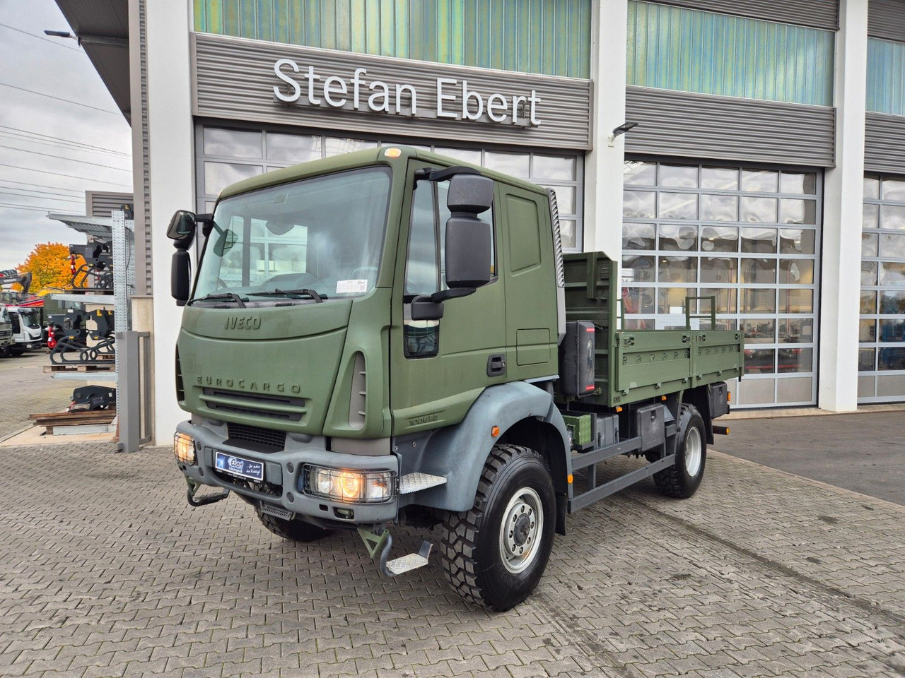 Iveco Eurocargo ML100E22WM-BW 4x4 Pritsche L-Haus Bett - Bortu kravas automašīna/ Platforma: foto 1 Iveco Eurocargo ML100E22WM-BW 4x4 Pritsche L-Haus Bett - Bortu kravas automašīna/ Platforma: foto 1