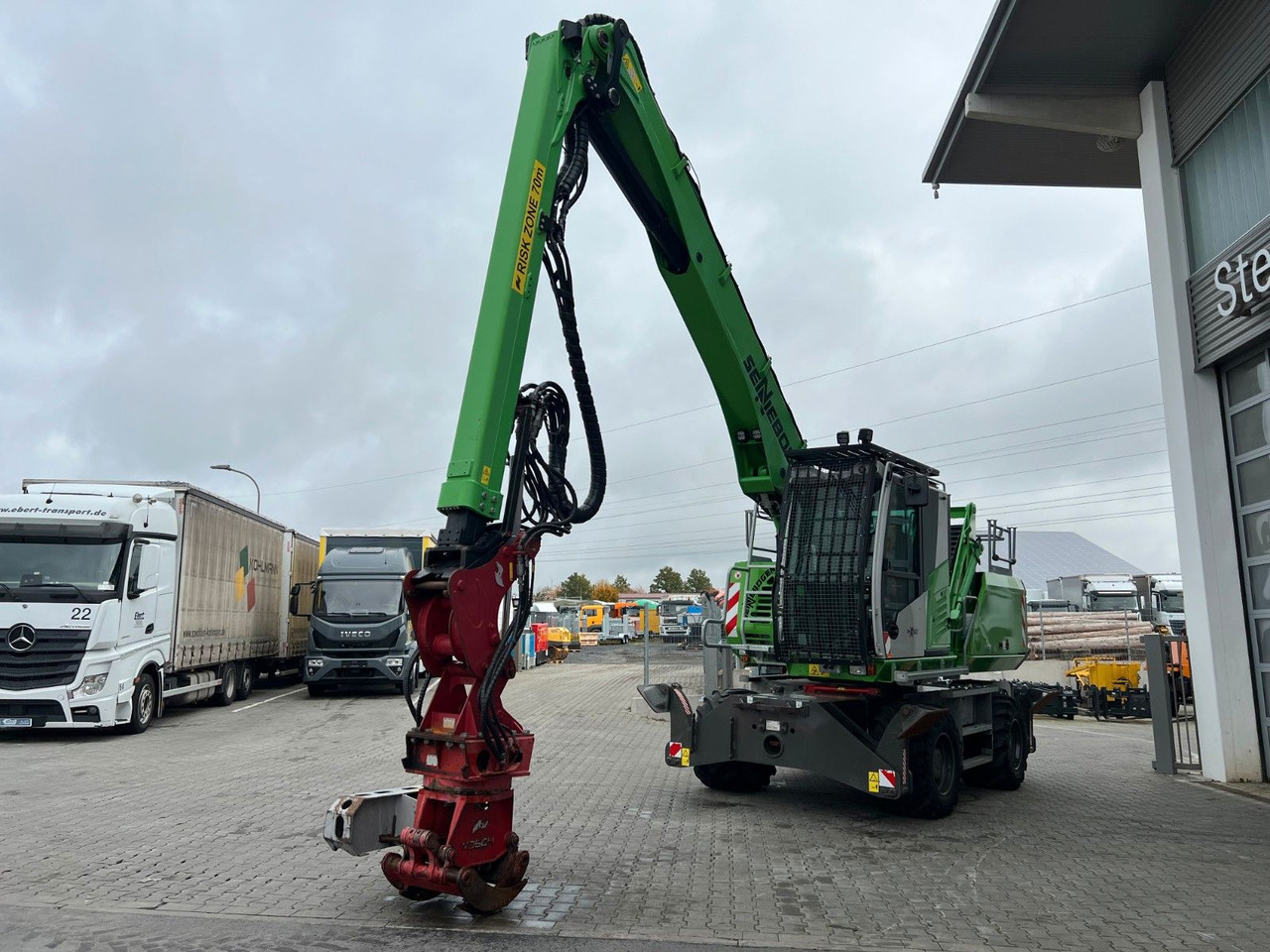 Sennebogen 718 / inkl. Vosch Fällzange / nur 1.965h! - Riteņu ekskavators: foto 5 Sennebogen 718 / inkl. Vosch Fällzange / nur 1.965h! - Riteņu ekskavators: foto 5