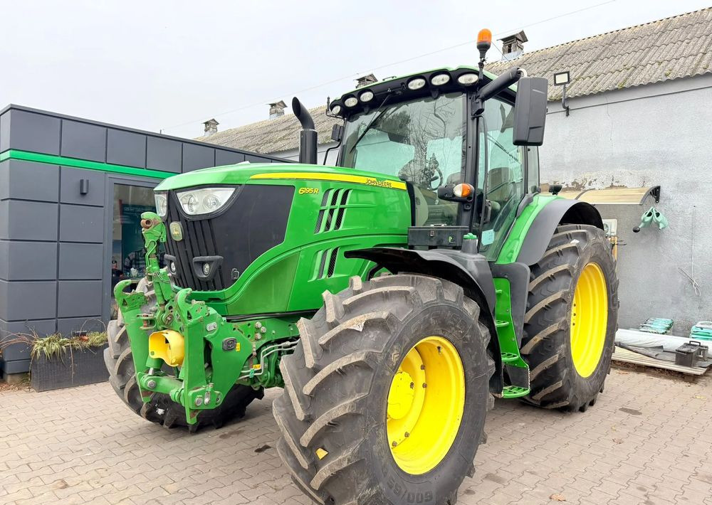 John Deere 6195 R - Traktors: foto 1 John Deere 6195 R - Traktors: foto 1