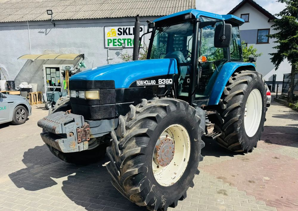 New Holland 8360 - Traktors: foto 1 New Holland 8360 - Traktors: foto 1