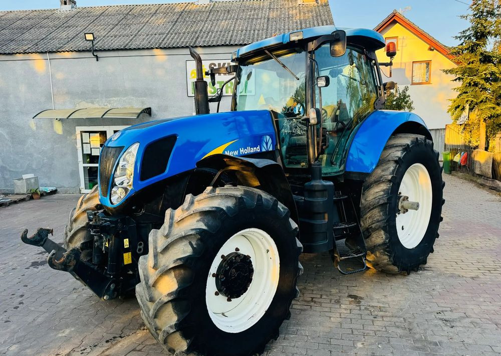 New Holland T7030 - Traktors: foto 1 New Holland T7030 - Traktors: foto 1