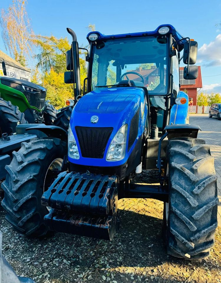 New Holland TD5.95 - Traktors: foto 1 New Holland TD5.95 - Traktors: foto 1