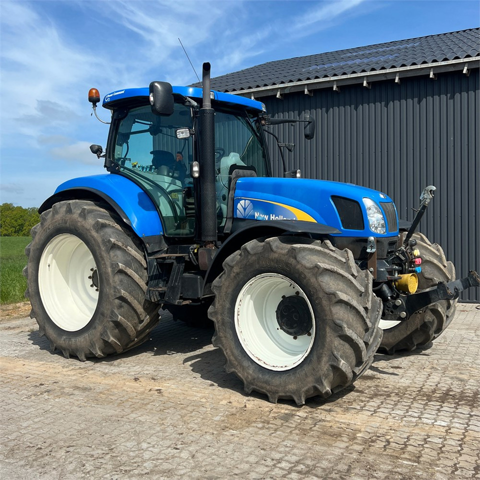 New Holland T6050 - Traktors: foto 2 New Holland T6050 - Traktors: foto 2