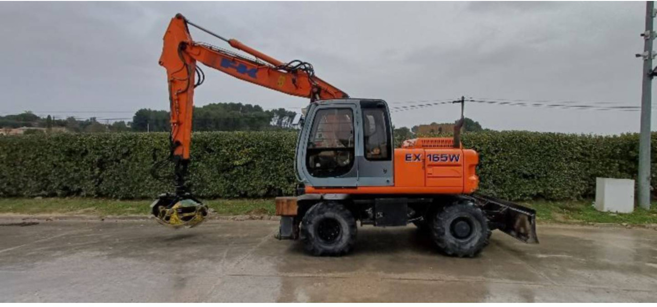 FIAT ALLIS / NEW HOLLAND EX165W - Riteņu ekskavators: foto 1 FIAT ALLIS / NEW HOLLAND EX165W - Riteņu ekskavators: foto 1