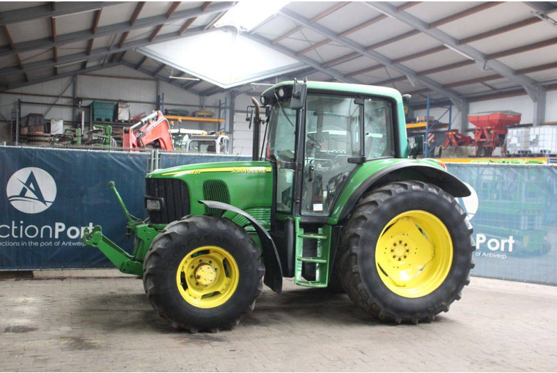 John Deere 6320 Premium - Traktors: foto 1 John Deere 6320 Premium - Traktors: foto 1