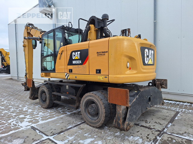 Cat MH3024-06C - Atkritumu iekrāvējs: foto 2 Cat MH3024-06C - Atkritumu iekrāvējs: foto 2